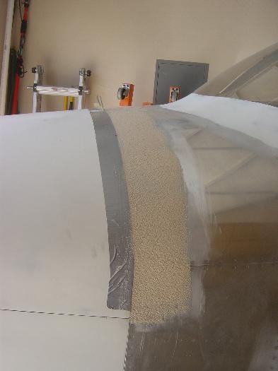 Flox base applied prior to filling/blending cowl to upper fwd fuse