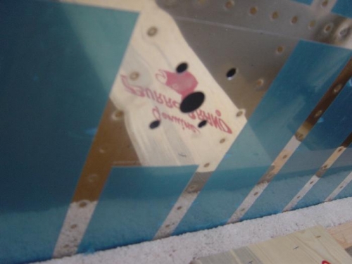 Mounting holes for right Com antenna drilled in bottom skin