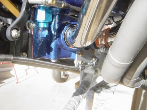 Cable mounting bracket attached to bottom left side of Cold air induction plenum