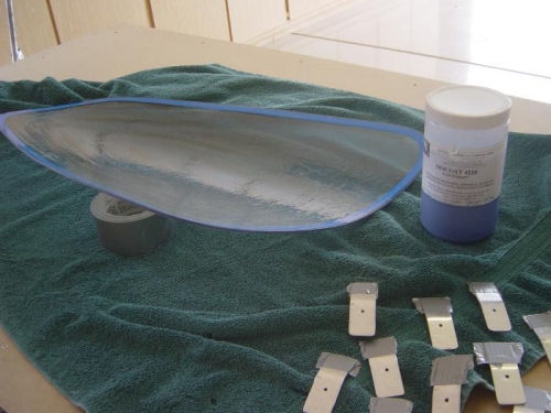 peelable protective coating being applied to rear windows on both sides, Also 