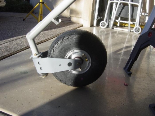 Nose gear attached to Engine mount and Nose fork and wheel assembly attached to gear leg