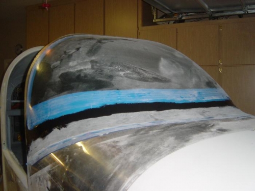 Thick Black epoxy applied to upper fairing .