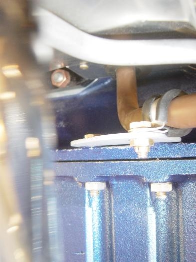 Mounting bracket and Metered Fuel hose attached