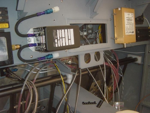 Rearranged sub-panel and enlarged center opening