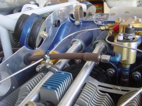 Fuel purge/return line routed through # 5 baffle grommet