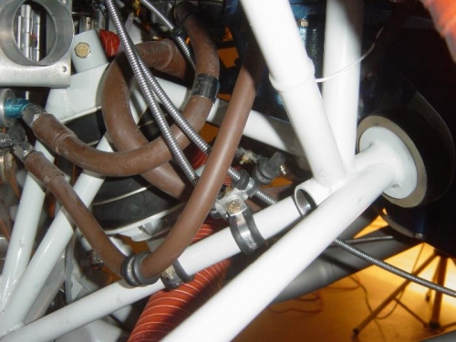 Mixture and throttle cables secured to engine mount to avoid chaffing