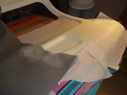 Spray adhessive applied to foam covered fiberglass door panel