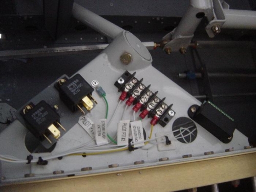 Door Ajar relays and trim relay deck mounted atop Left gear mount