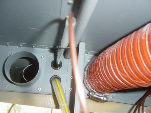Main distributin line going through alum conduit in Overhead console