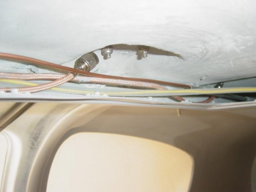 Conduit and high pressure line in forward portion of Overhead