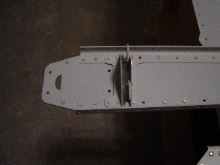 Bottom rudder attach bracket and rudder stops