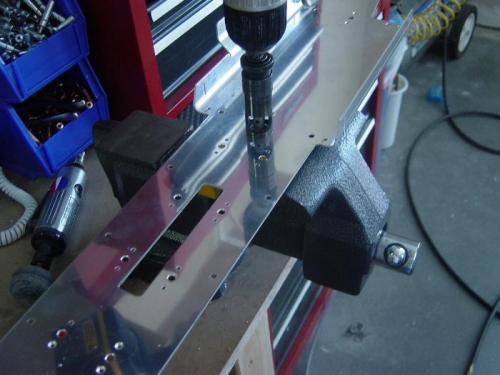 Countersink battery/bellcrank mount