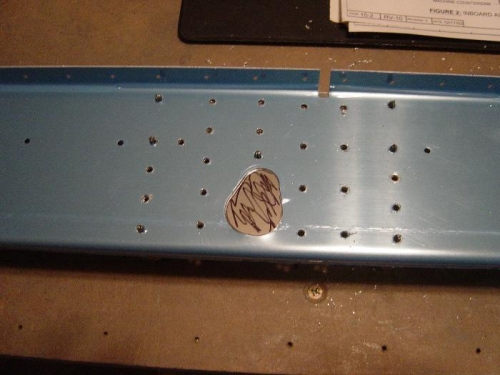 Mark one of the doublers for cut out for aileron push tobe clearance.