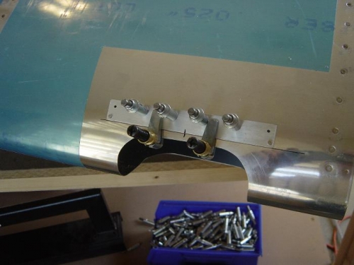 The top retaining clip being drilled