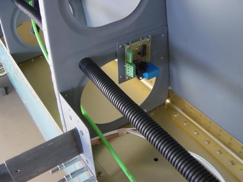 Heated pitot control module riveted in place