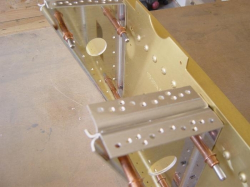 Mid seat rail supports countersunk for nutplates