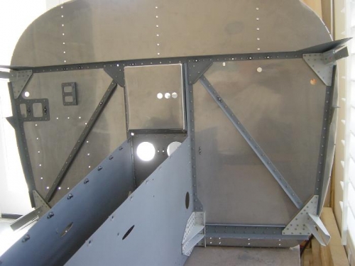 Both ribs riveted to the firewall