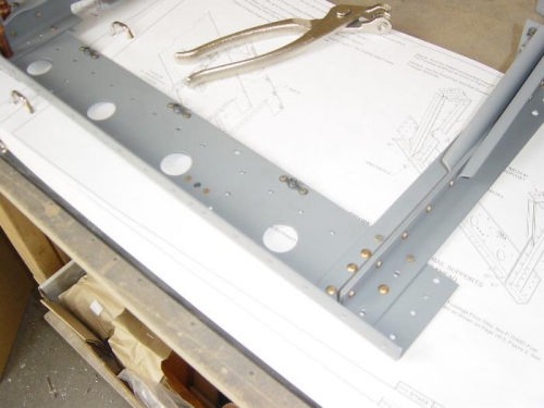 Attach nutplates and seat rail supports to blkhds