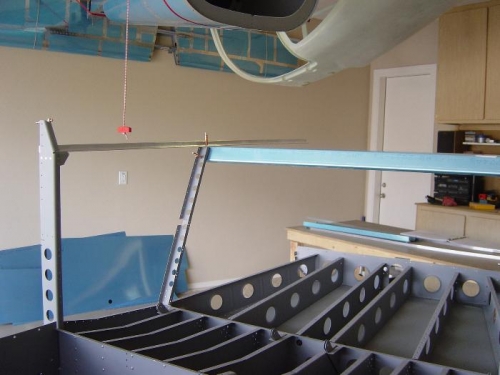 Seat back support brace clecoed in position