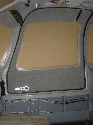 Painter door w/ upholstered door panel velcro attached