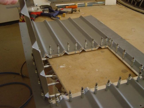 Aft baggage bulkhead access door cut drilled and clecoed