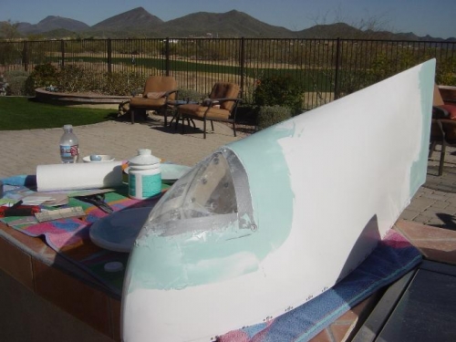 Lens cut, trimmed and installed, being faired to wingtip with filler.