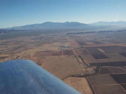 Airport off to the left.  Catalina mountains center, Rincon mountains distant right.