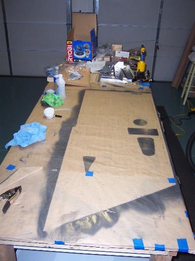 Outline of the skin on the paper covering the table.
