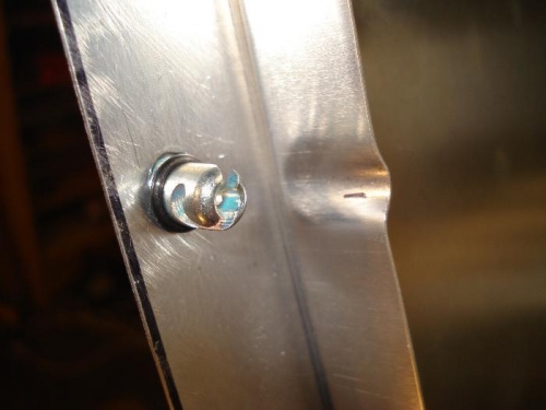 An O-Ring on the Dzus quarter turn holds it in place quite  nicely.