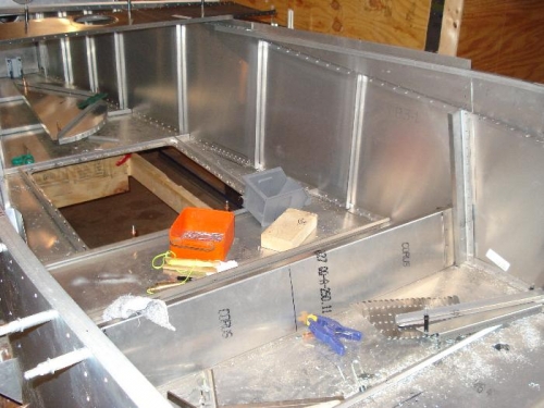 Got the baggage compartment floor support riveted onto the side skins.