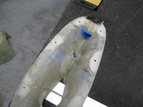 Making a glass layup to keep the leg fairing in place