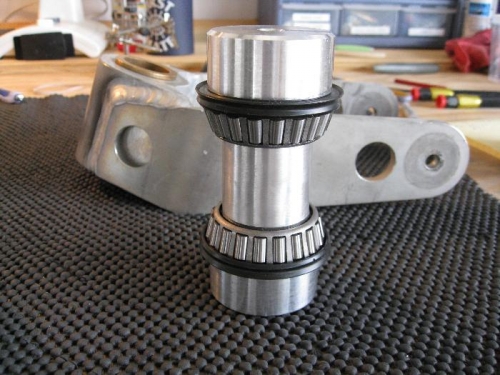 Bushing spacer with outside bushings