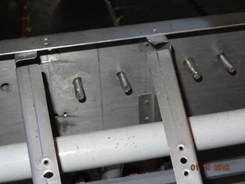 Hardware bolts inserted in the center section of the spar