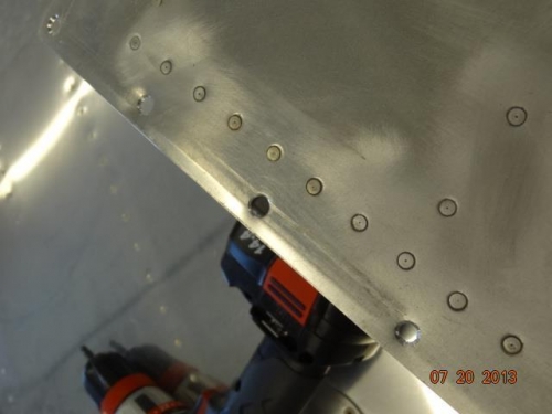 Fuel tank holes that were enlarged by countersinking and screws