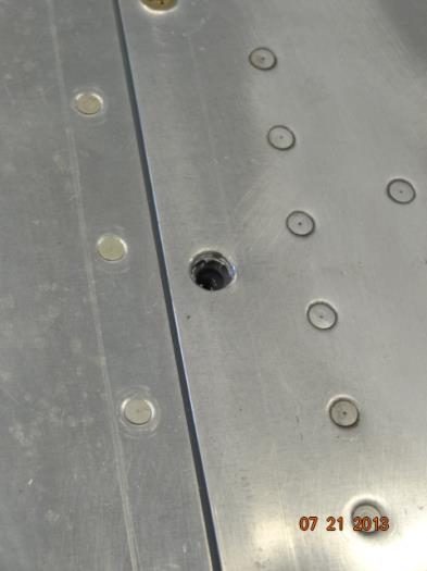 The enlarged screw hole