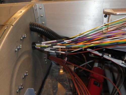 The labels on the wires prevent the wires from being pulled thru the subpanel