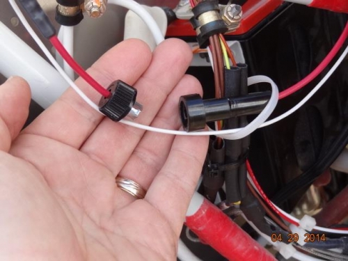 The in-line fuse holder where the fuse had blown. A 10-amp fuse was reinstalled
