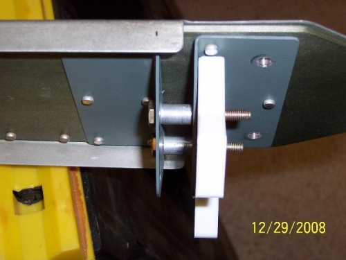 Rudder stop with spacers between the hinge brackets