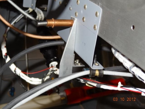 The bracket in place on the control bracket on instrument subpanel