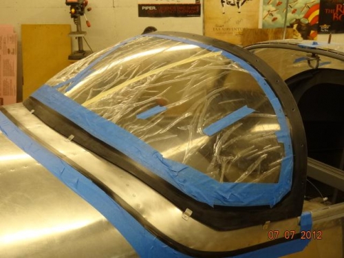 The fuselage taped and the windshield in place