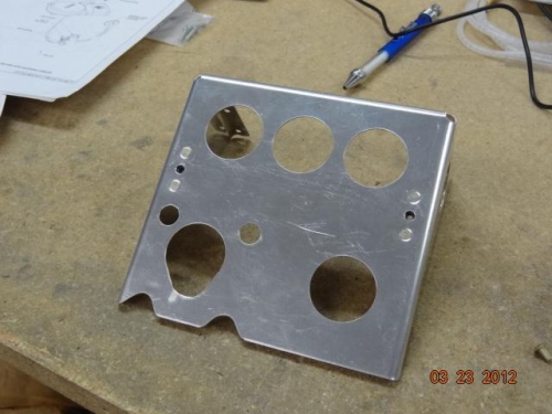 The bracket modified for the GPS antenna screw pegs