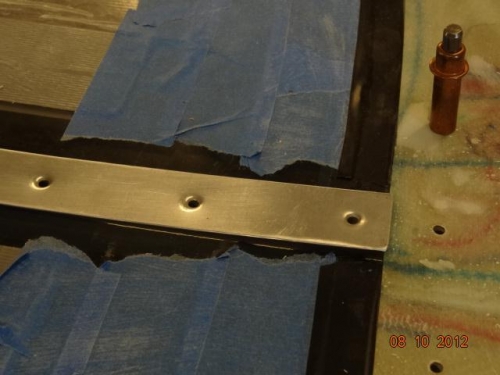 The aft end of the cover strip trimmed