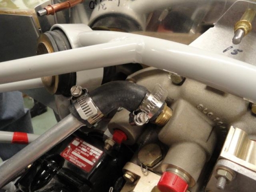 The oil breather tube and hose clamped in place