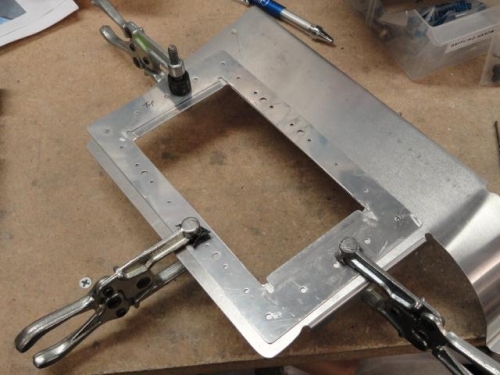 The doubler clamped to the baffle for transferring holes to the baffle