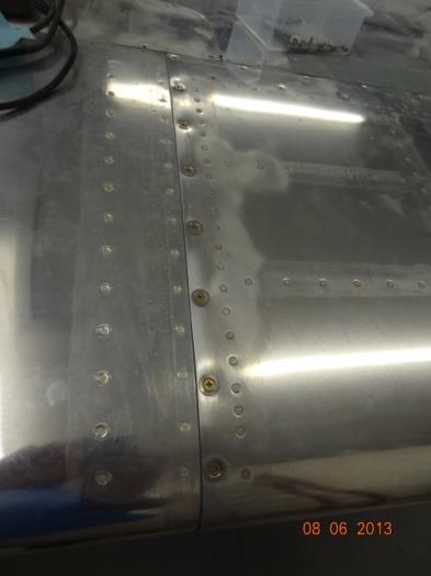 The fuel tank in place with screws and washers