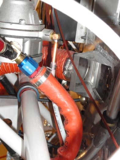 The fuel pump overflow plug with the plastic tube safetied