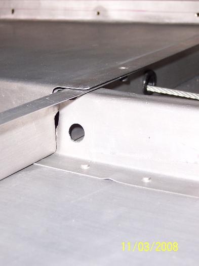 Hole for Smoke System Vent Tubing in bracket above the baggage side panel