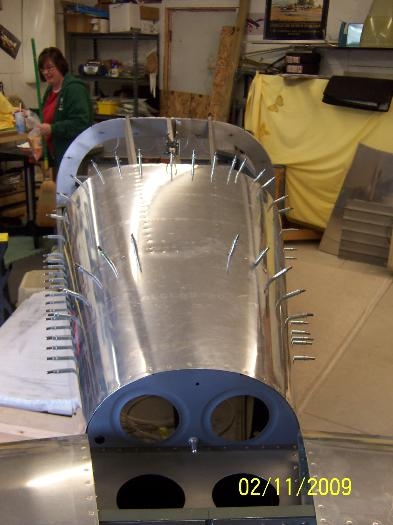 Center of top skin riveted to fuselage