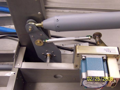 The pitch servo control rod connected to the elevator bellcrank
