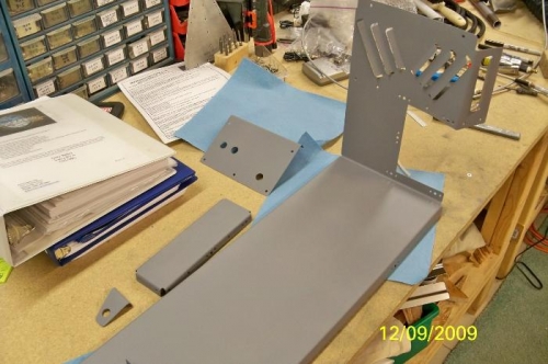The center cabin cover, access cover, bracket, and ELT bracket primed
